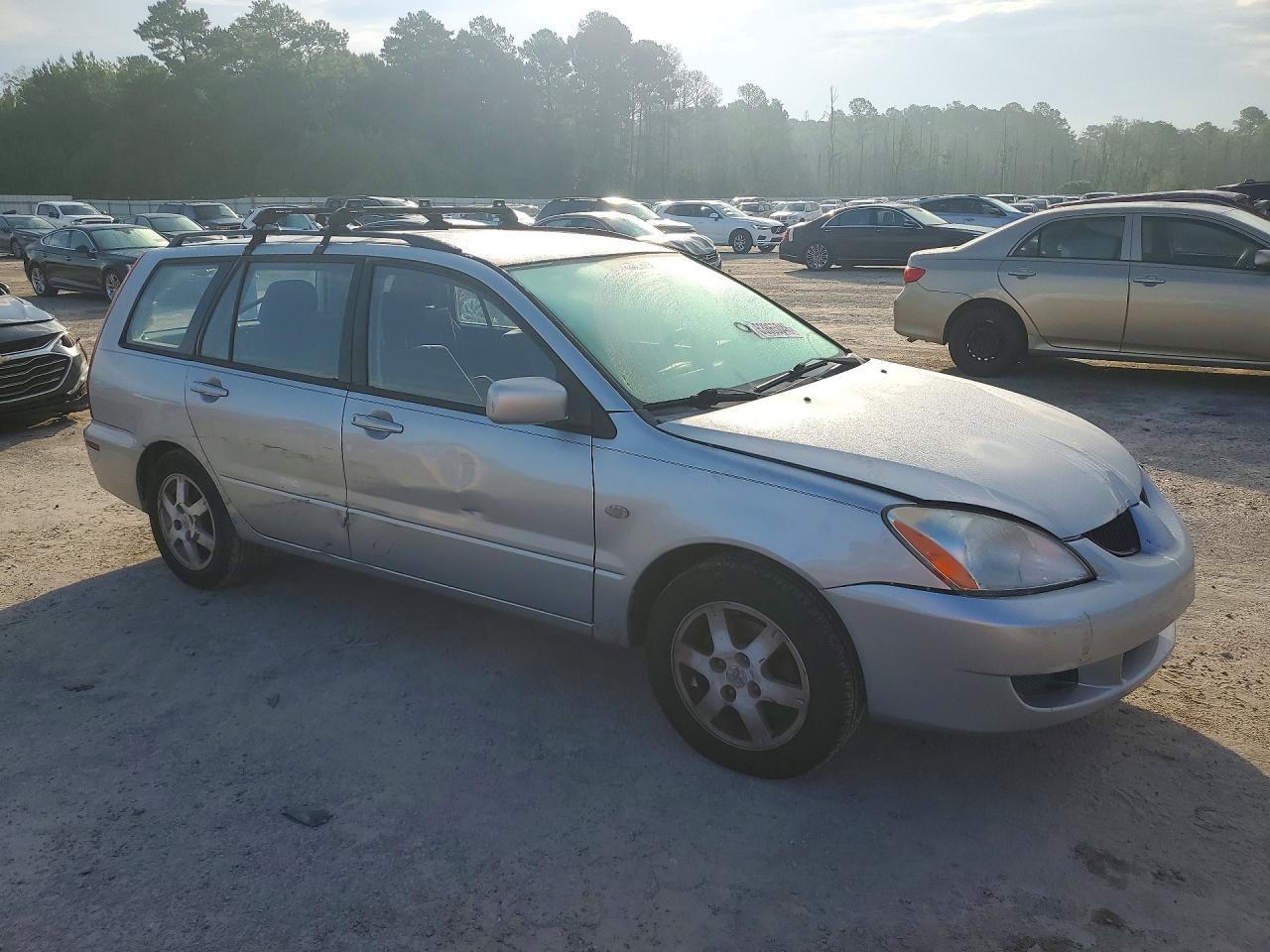 JA3AD29F84U010381 · 2004 MITSUBISHI LANCER · 4/12