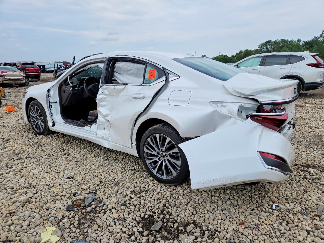 58AD11D1XMU001876 · 2021 LEXUS ES 250 · 2/12