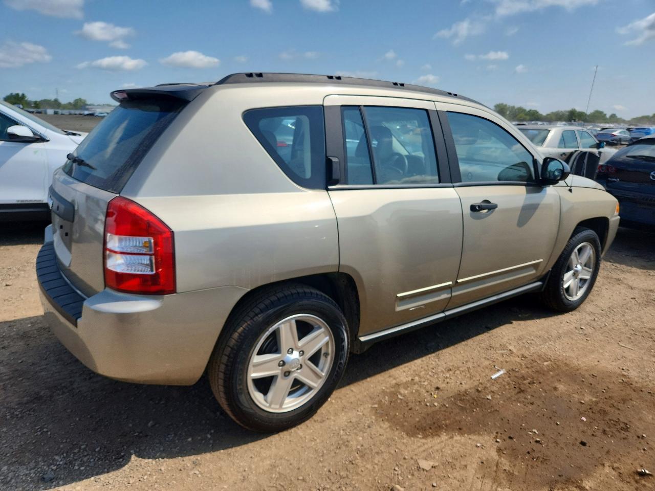 1J4FT47A69D173853 · 2009 JEEP COMPASS · 3/12