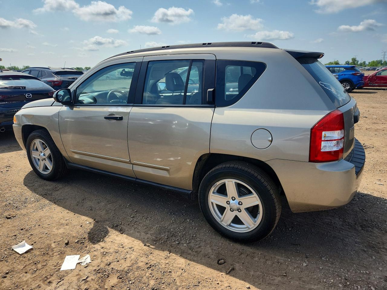 1J4FT47A69D173853 · 2009 JEEP COMPASS · 2/12