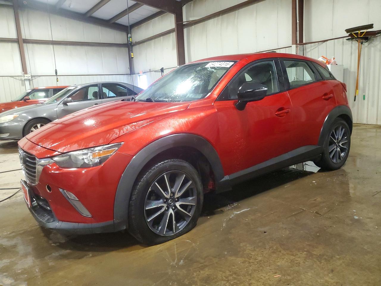 JM1DKFC73J1324319 · 2018 MAZDA CX-3