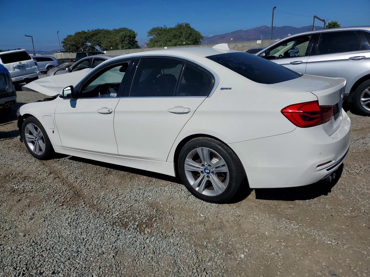WBA8E1C50JA178534 · 2018 BMW 330E · 2/13