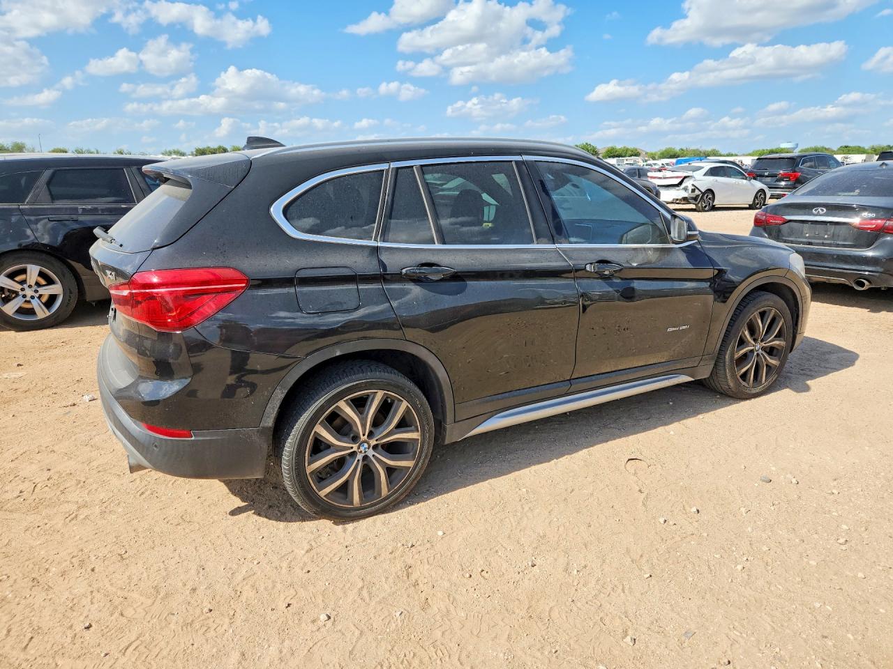WBXHU7C35H5H34790 · 2017 BMW X1 · 3/14