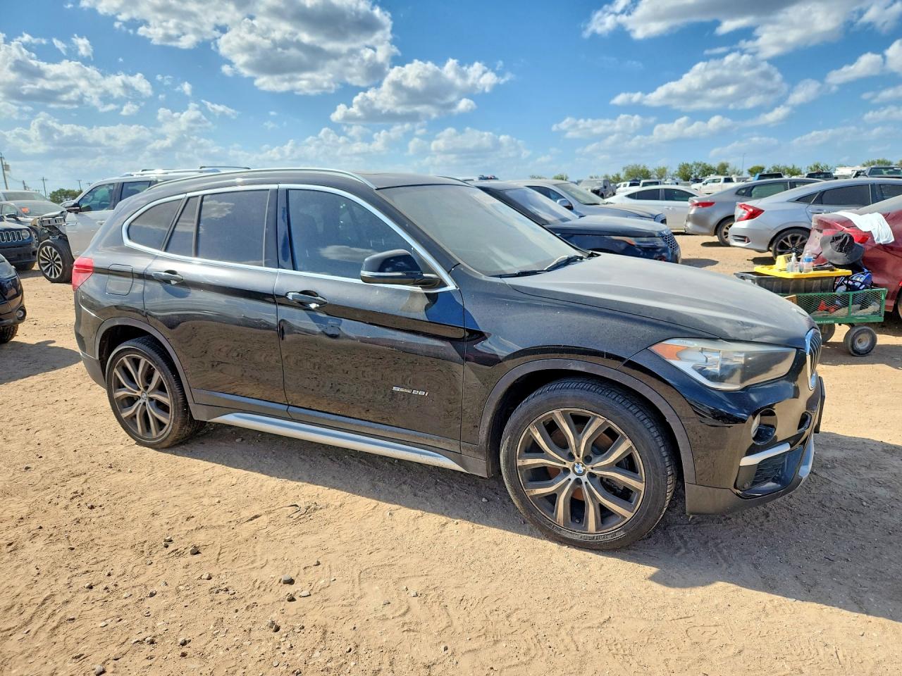 WBXHU7C35H5H34790 · 2017 BMW X1 · 4/14