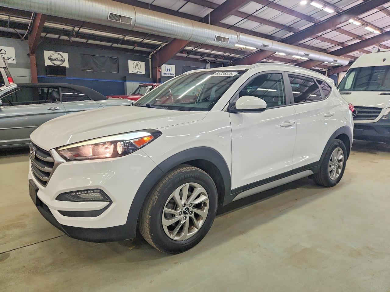 KM8J3CA48JU674482 · 2018 HYUNDAI TUCSON