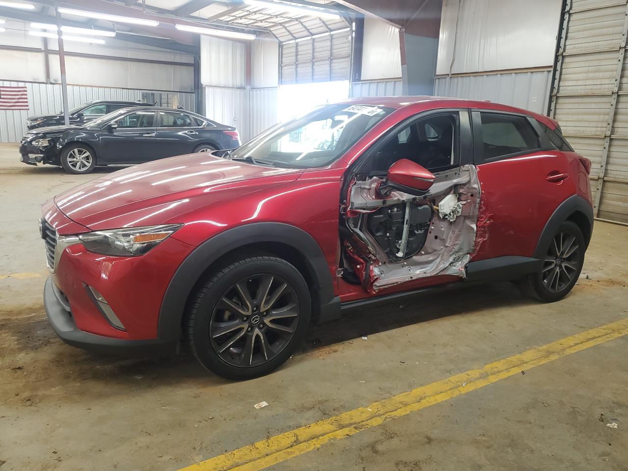 JM1DKDC74J0320239 · 2018 MAZDA CX-3