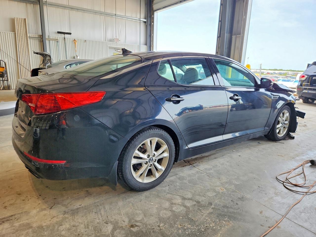 KNAGN4A72B5099720 · 2011 KIA OPTIMA · 3/13