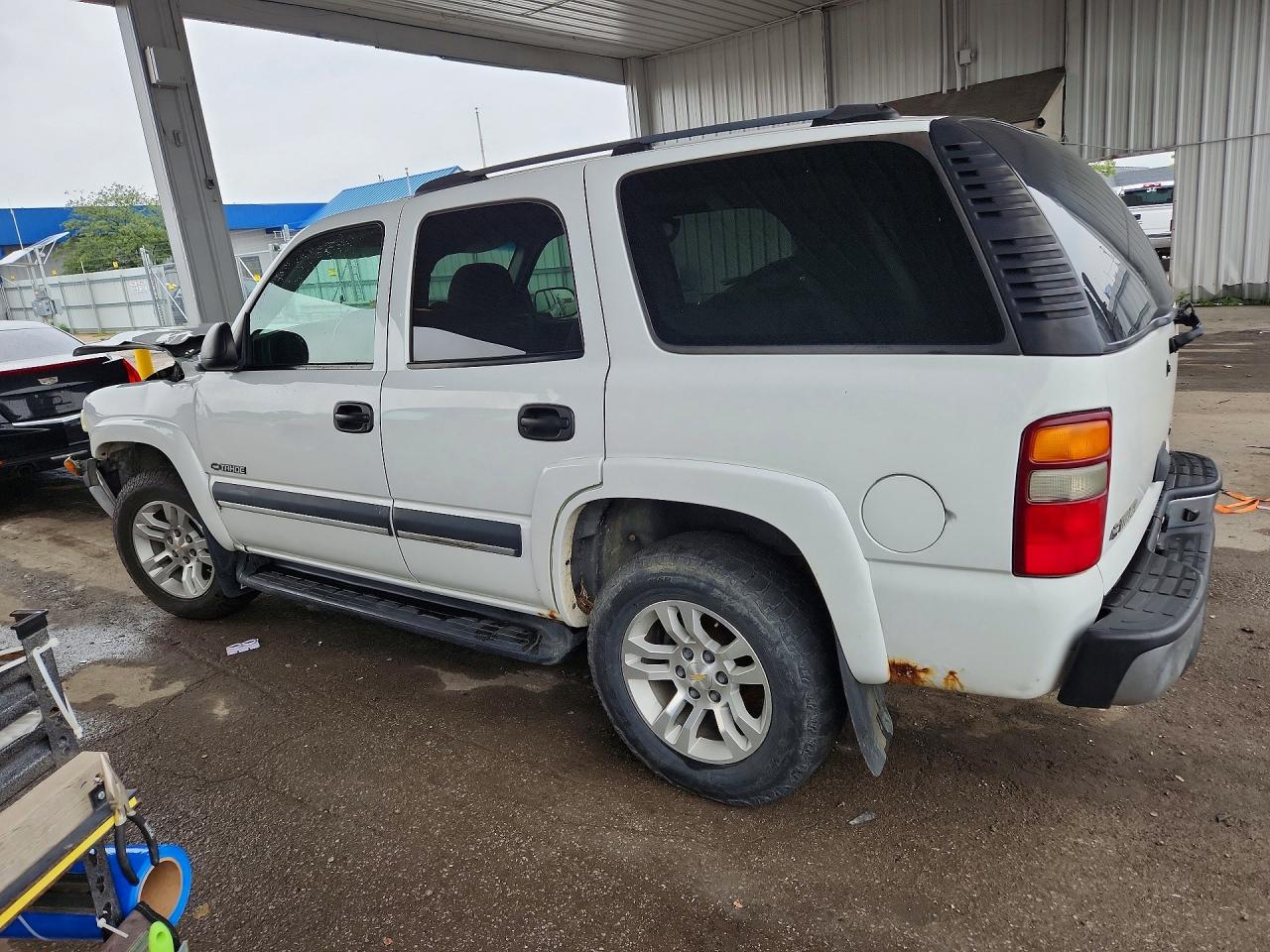 1GNEK13Z43J189712 · 2003 CHEVROLET TAHOE · 2/13