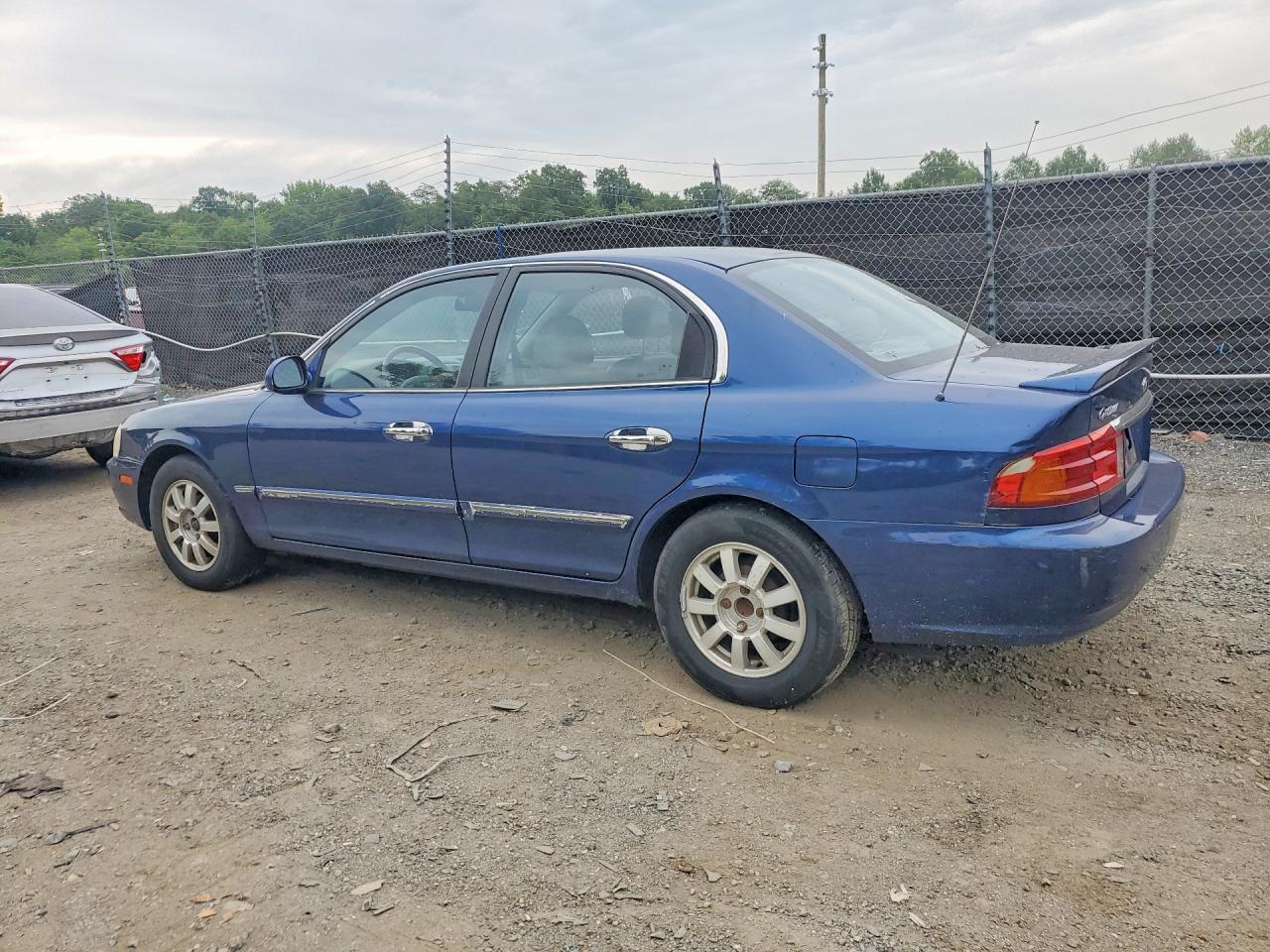KNAGD126025169075 · 2002 KIA OPTIMA · 2/12