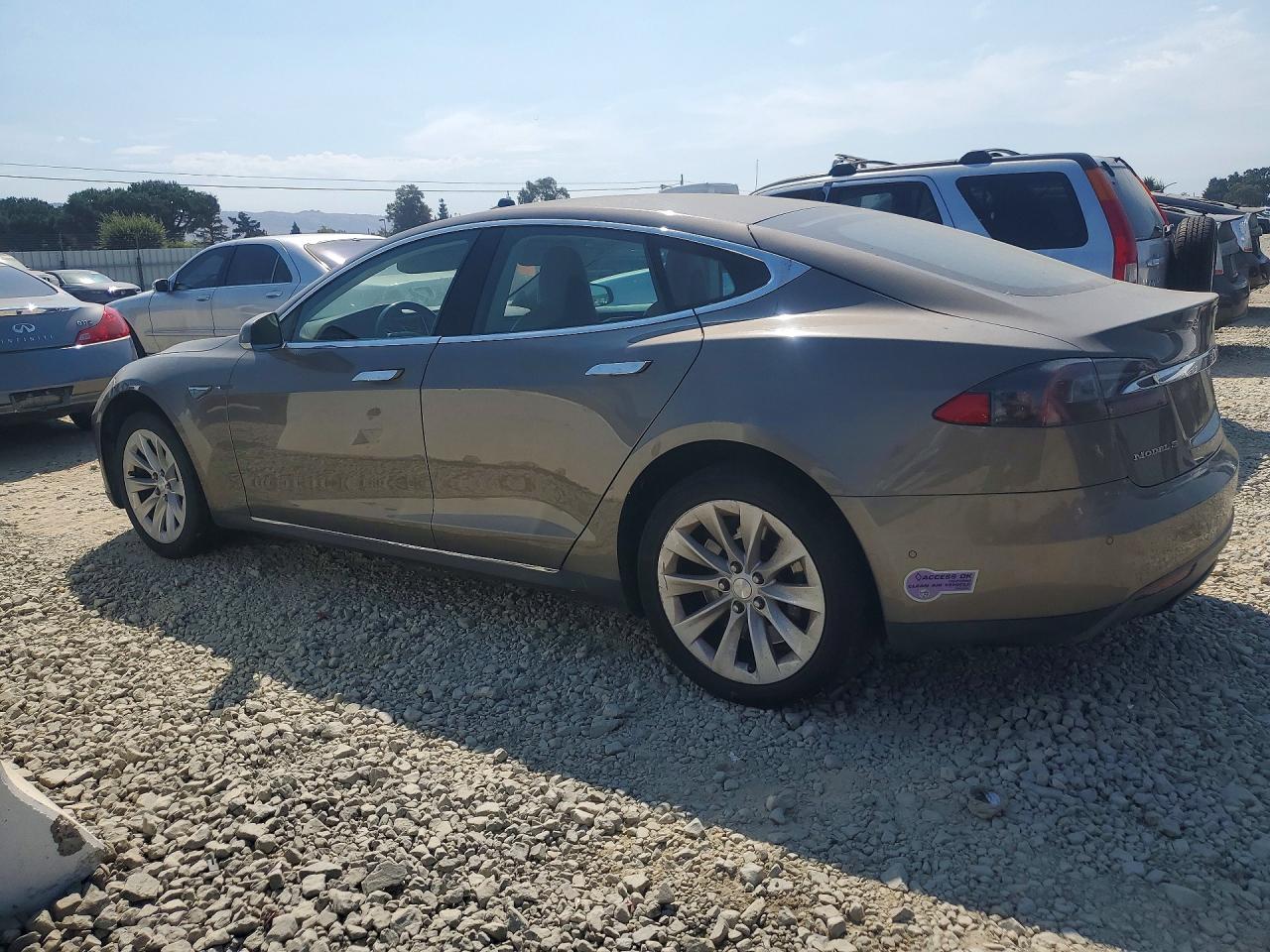 5YJSA1E13GF133974 · 2016 TESLA MODEL S · 2/12