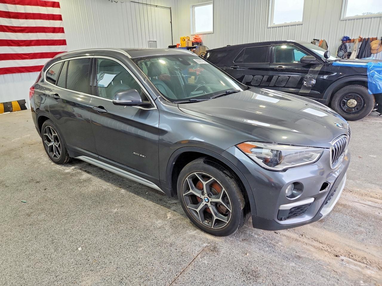WBXHT3C31G5E47182 · 2016 BMW X1 · 4/13
