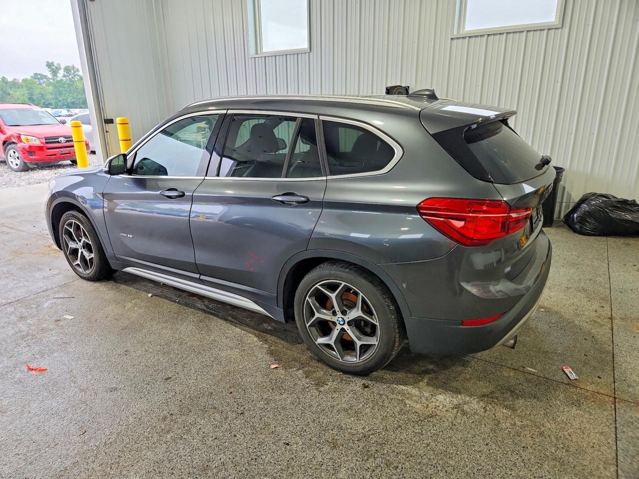 WBXHT3C31G5E47182 · 2016 BMW X1 · 2/13