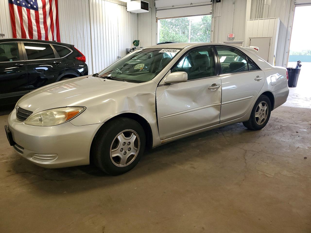 4T1BF32KX3U566070 · 2003 TOYOTA CAMRY