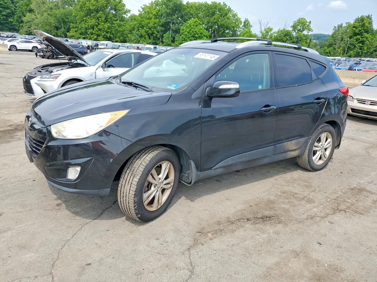 KM8JUCAC2DU584057 · 2013 HYUNDAI TUCSON