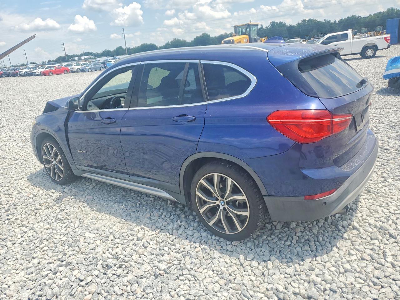 WBXHT3C37GP881818 · 2016 BMW X1 · 2/12