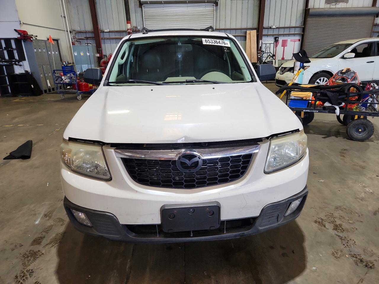 4F2CZ06G29KM02336 · 2009 MAZDA TRIBUTE · 5/13