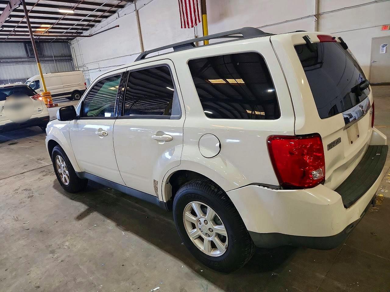 4F2CZ06G29KM02336 · 2009 MAZDA TRIBUTE · 2/13