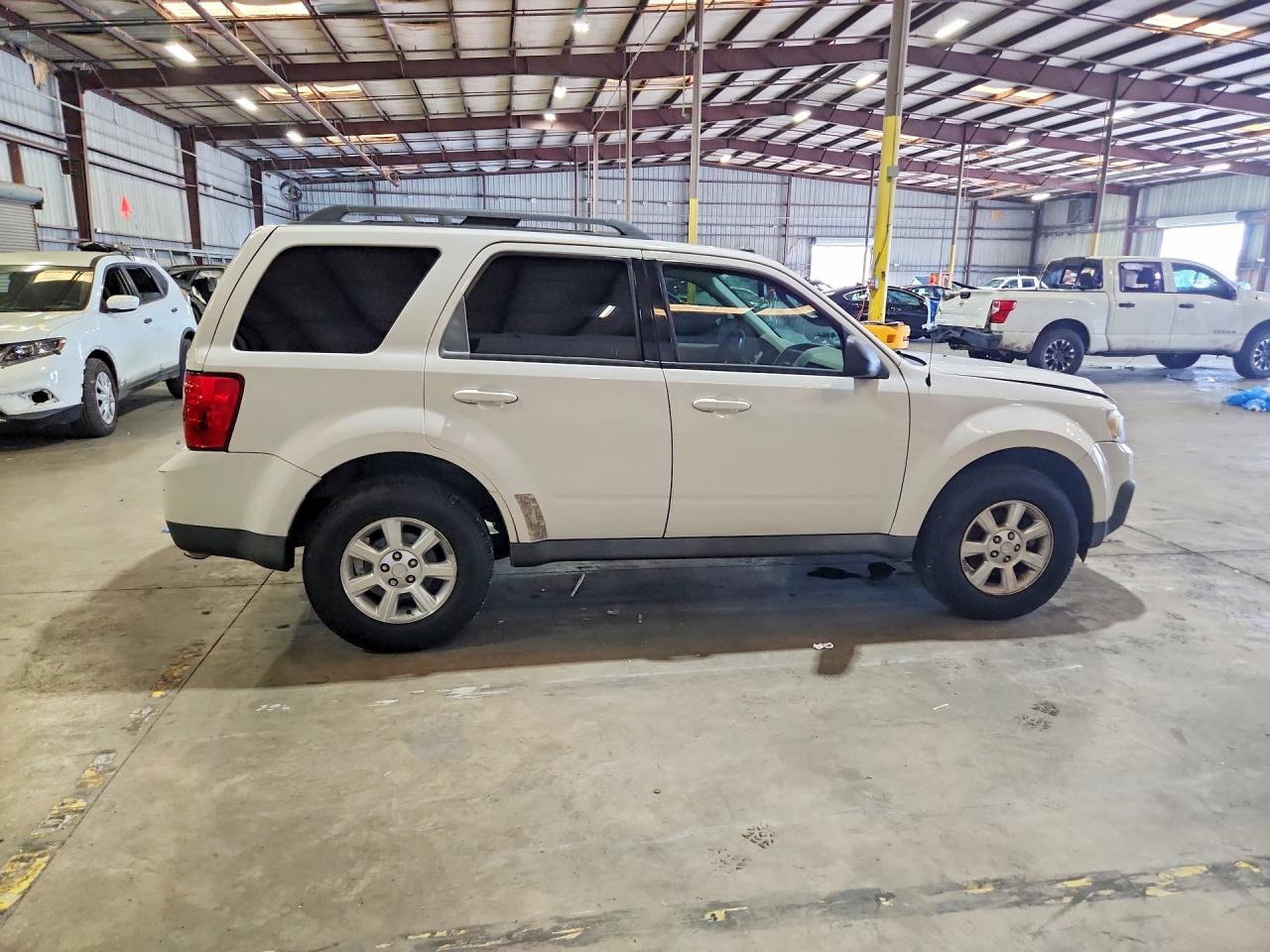 4F2CZ06G29KM02336 · 2009 MAZDA TRIBUTE · 3/13