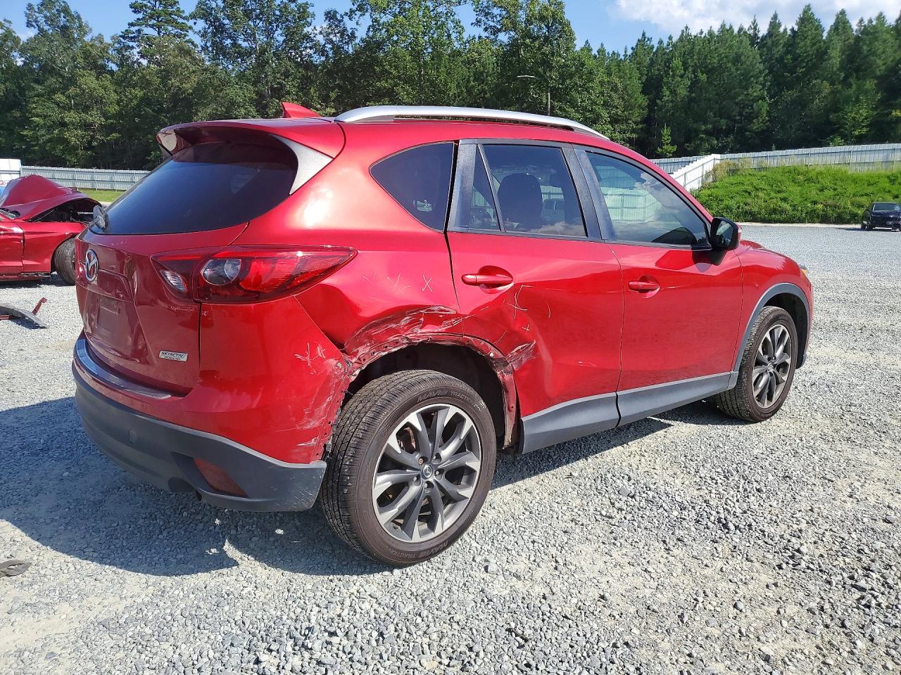 JM3KE2DY6G0730891 · 2016 MAZDA CX-5 · 3/13