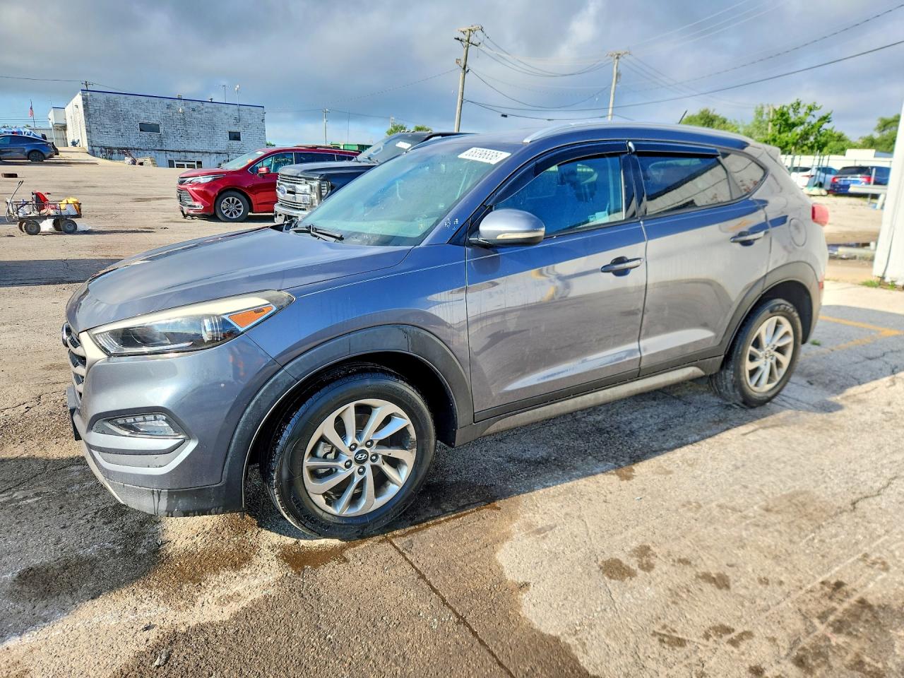 KM8J3CA26GU050249 · 2016 HYUNDAI TUCSON