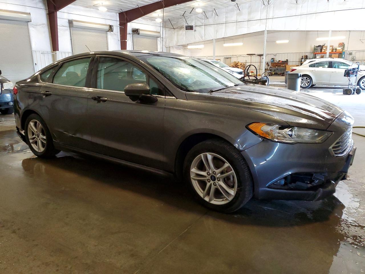 3FA6P0HD2JR158697 · 2018 FORD FUSION · 4/12