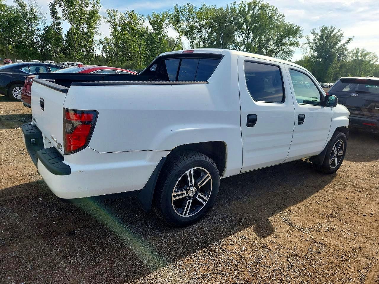 5FPYK1F75CB454037 · 2012 HONDA RIDGELINE · 3/13