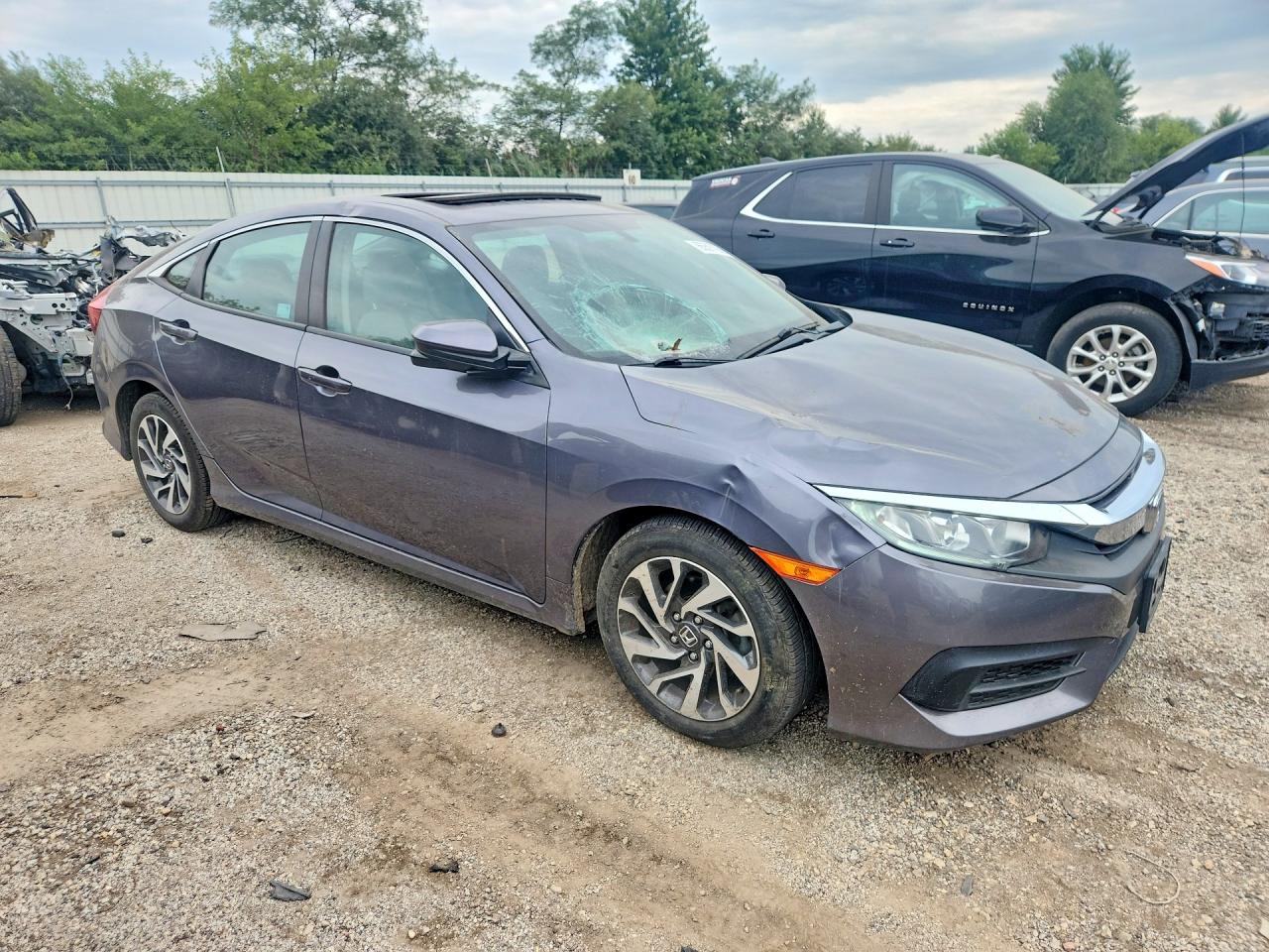 19XFC2F75JE037572 · 2018 HONDA CIVIC · 4/12