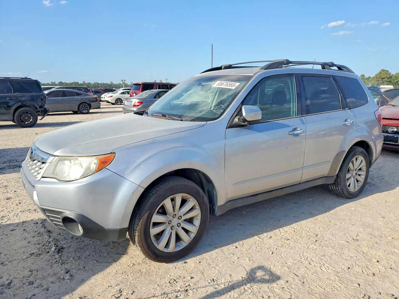 JF2SHBEC7CH412911 · 2012 SUBARU FORESTER
