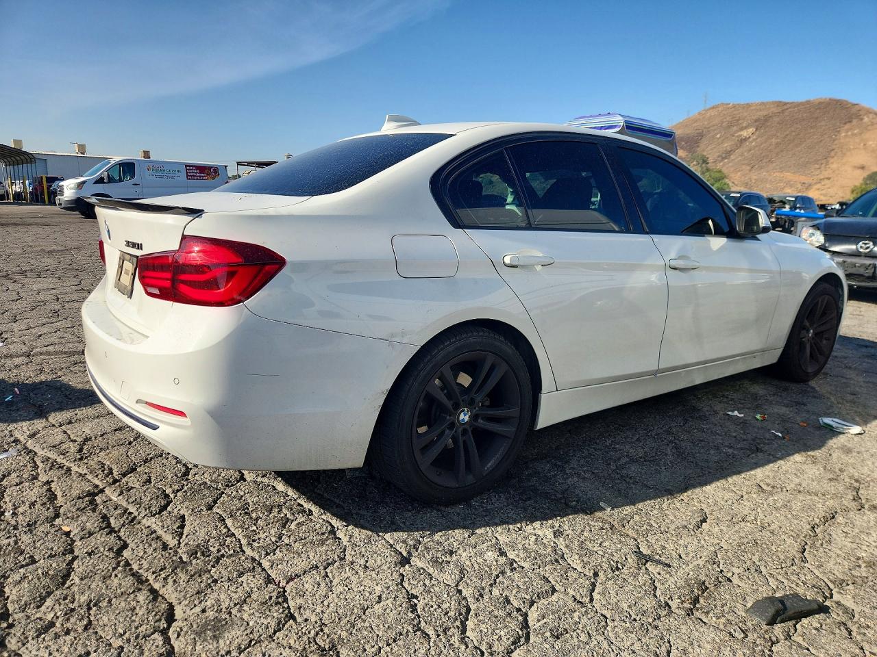 WBA8B9G57JNU98184 · 2018 BMW 330 · 3/12