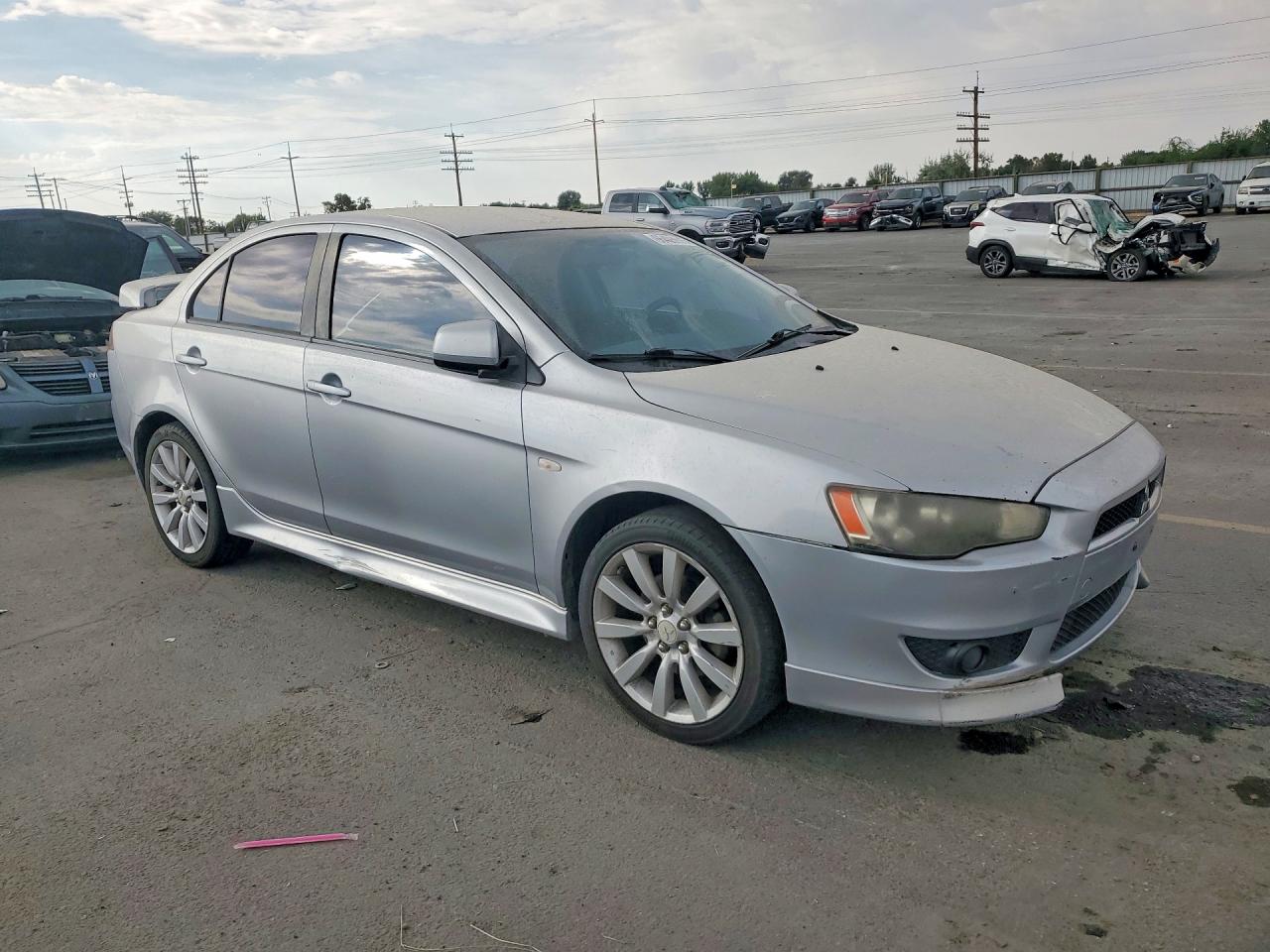 JA32U8FW4BU032063 · 2011 MITSUBISHI LANCER · 4/12