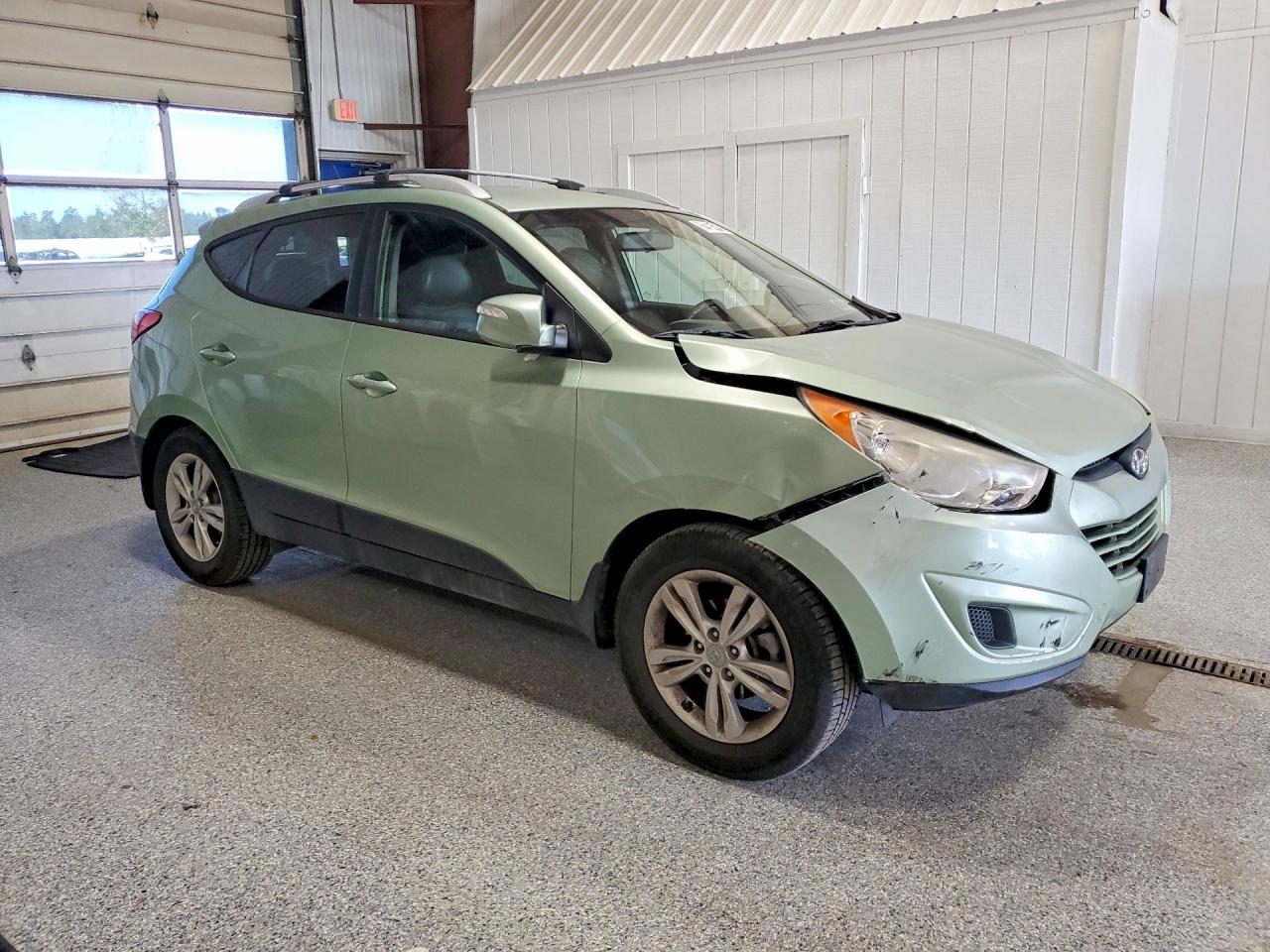 KM8JUCAC5CU385454 · 2012 HYUNDAI TUCSON · 4/13