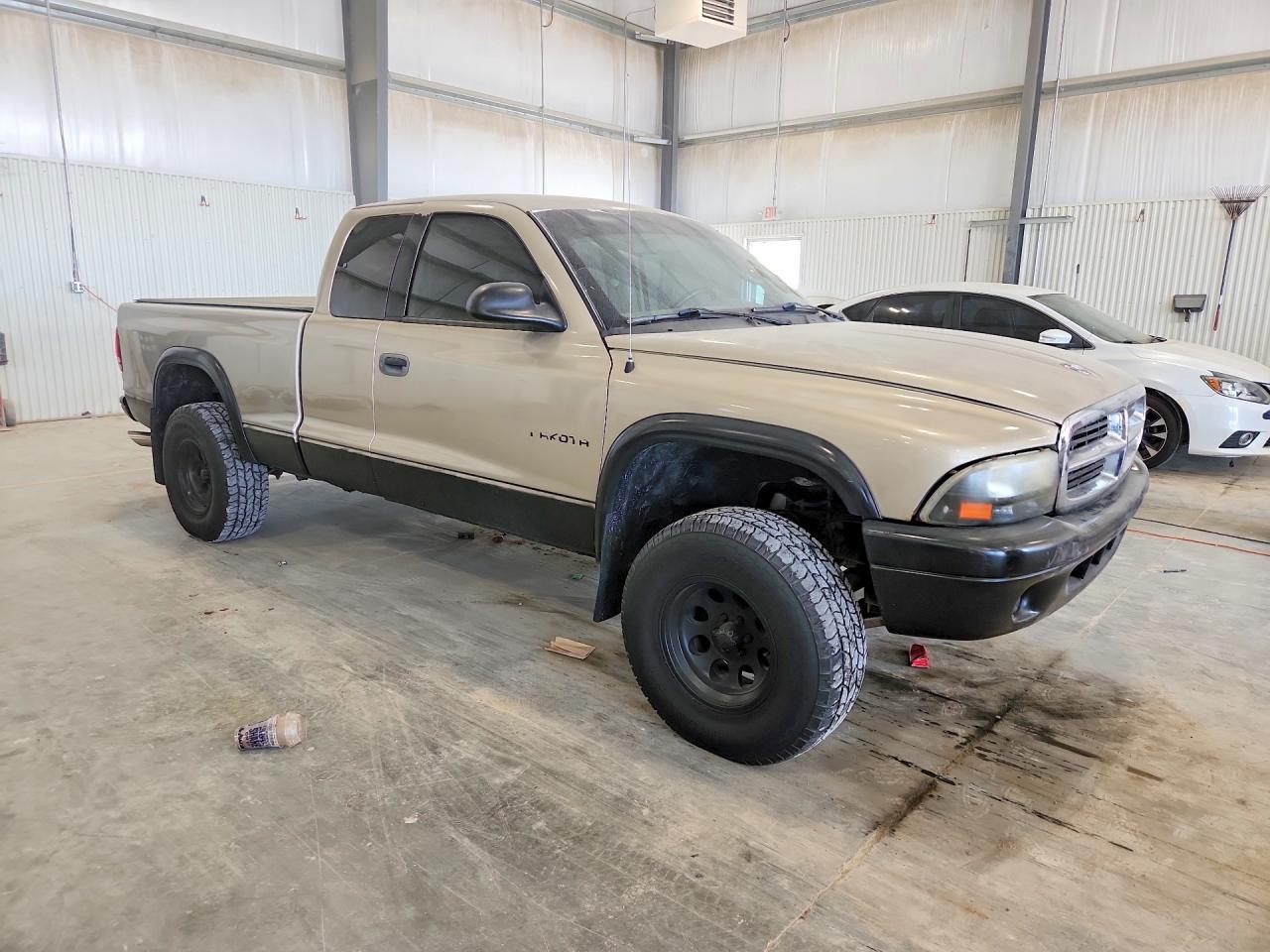1B7GG12X32S701021 · 2002 DODGE DAKOTA · 4/12