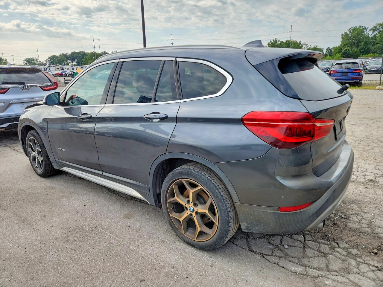WBXHT3C3XG5E47908 · 2016 BMW X1 · 2/12