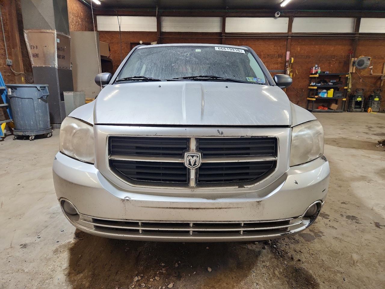 1B3CB9HA7AD598057 · 2010 DODGE CALIBER · 5/14