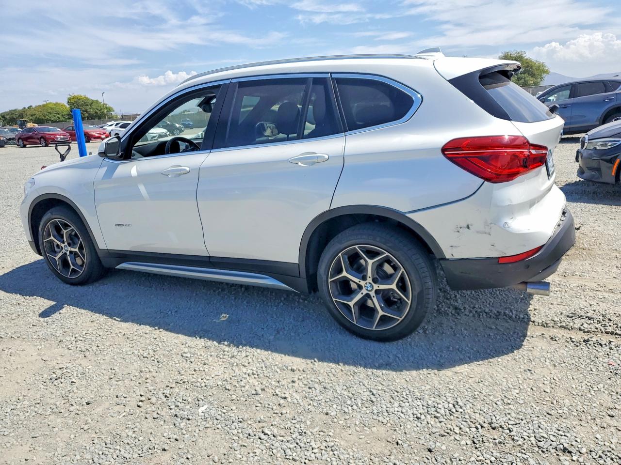 WBXHU7C39J5H44602 · 2018 BMW X1 · 2/12