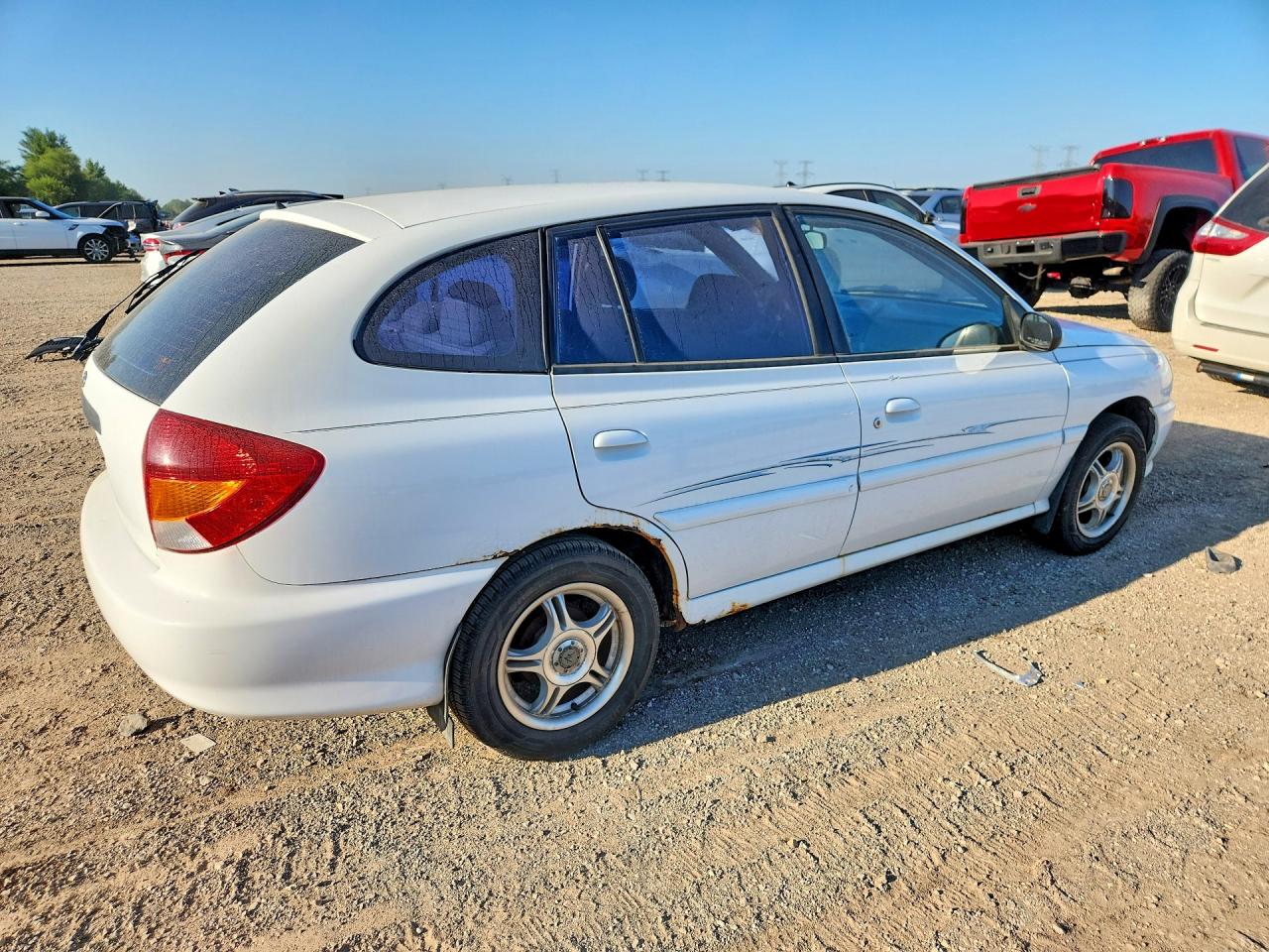 KNADC163126054694 · 2002 KIA RIO · 3/12