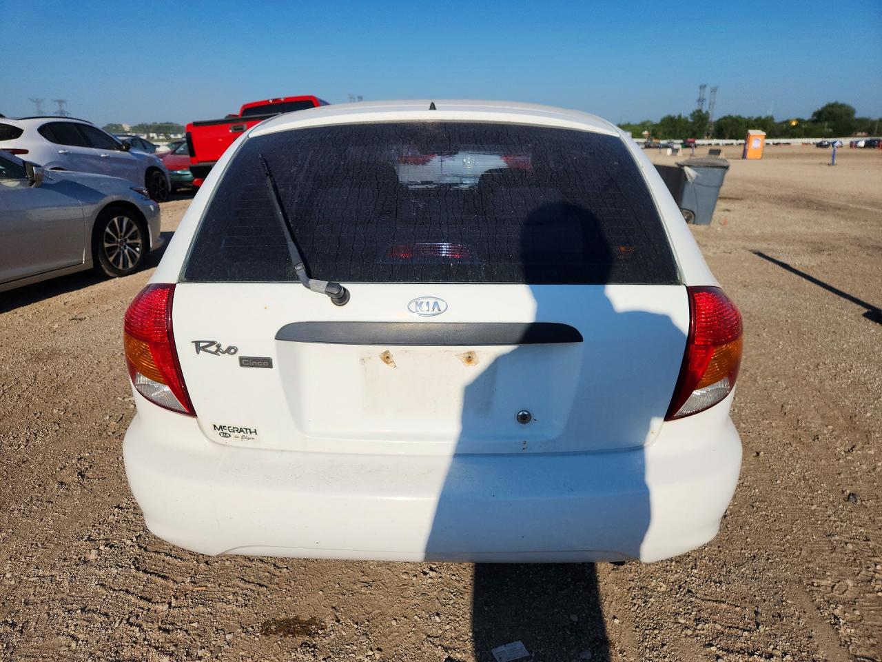 KNADC163126054694 · 2002 KIA RIO · 6/12