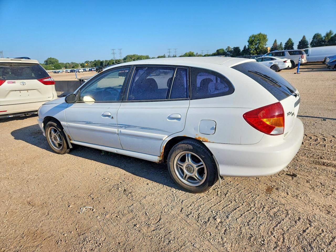 KNADC163126054694 · 2002 KIA RIO · 2/12