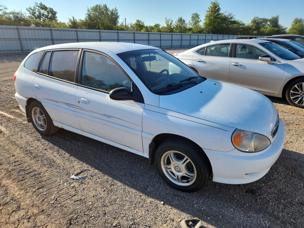 KNADC163126054694 · 2002 KIA RIO · 4/12