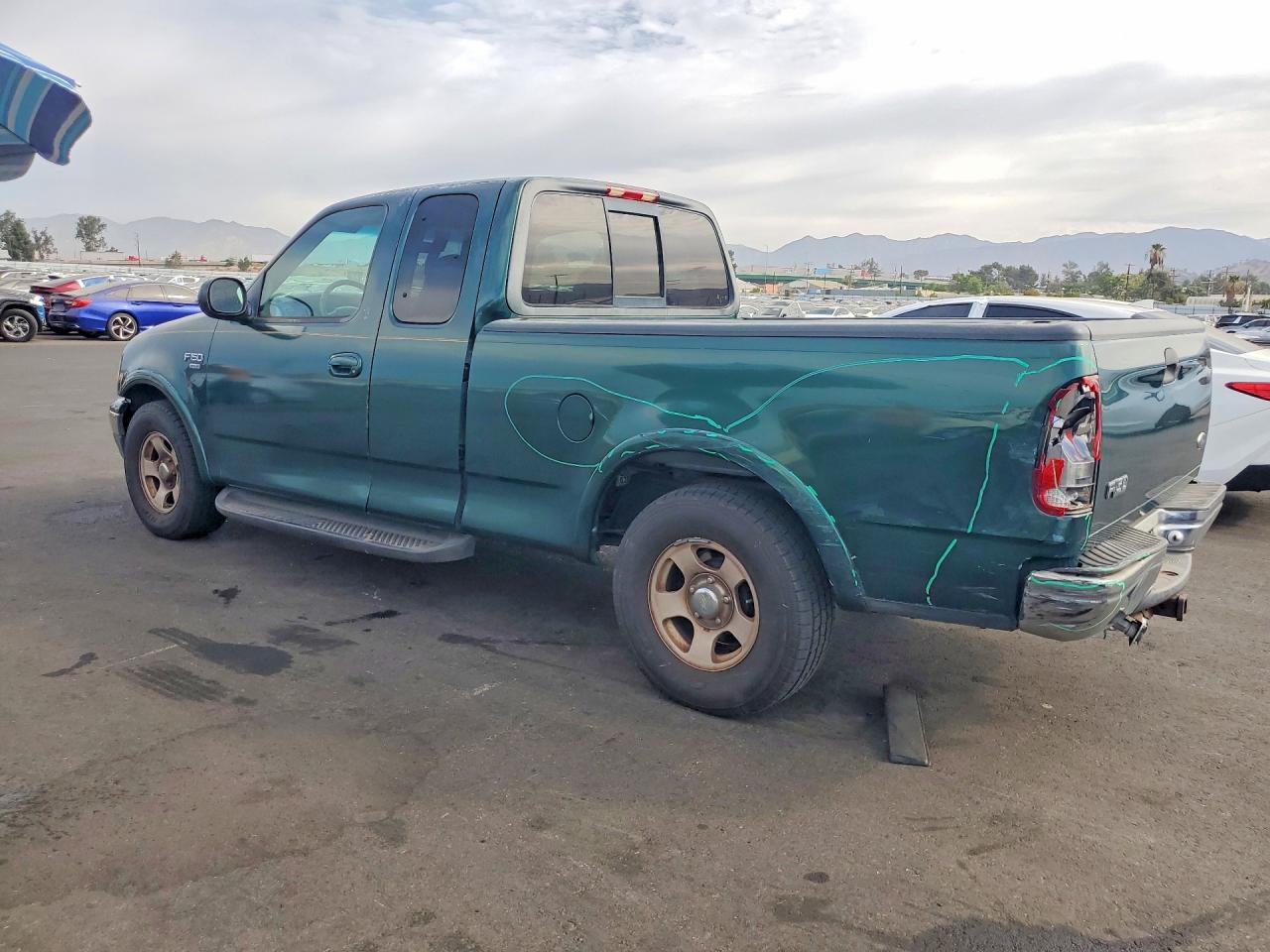 1FTRX17W4XKB50338 · 1999 FORD F150 · 2/12
