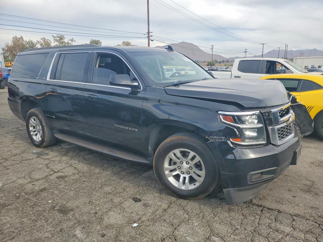 1GNSCHKC5KR168955 · 2019 CHEVROLET SUBURBAN · 4/13