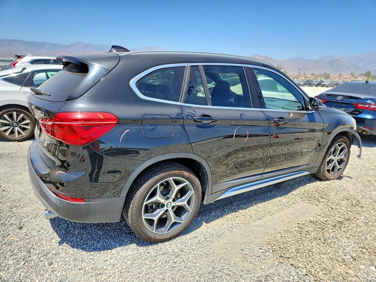 WBXHU7C34J5H40666 · 2018 BMW X1 · 3/14