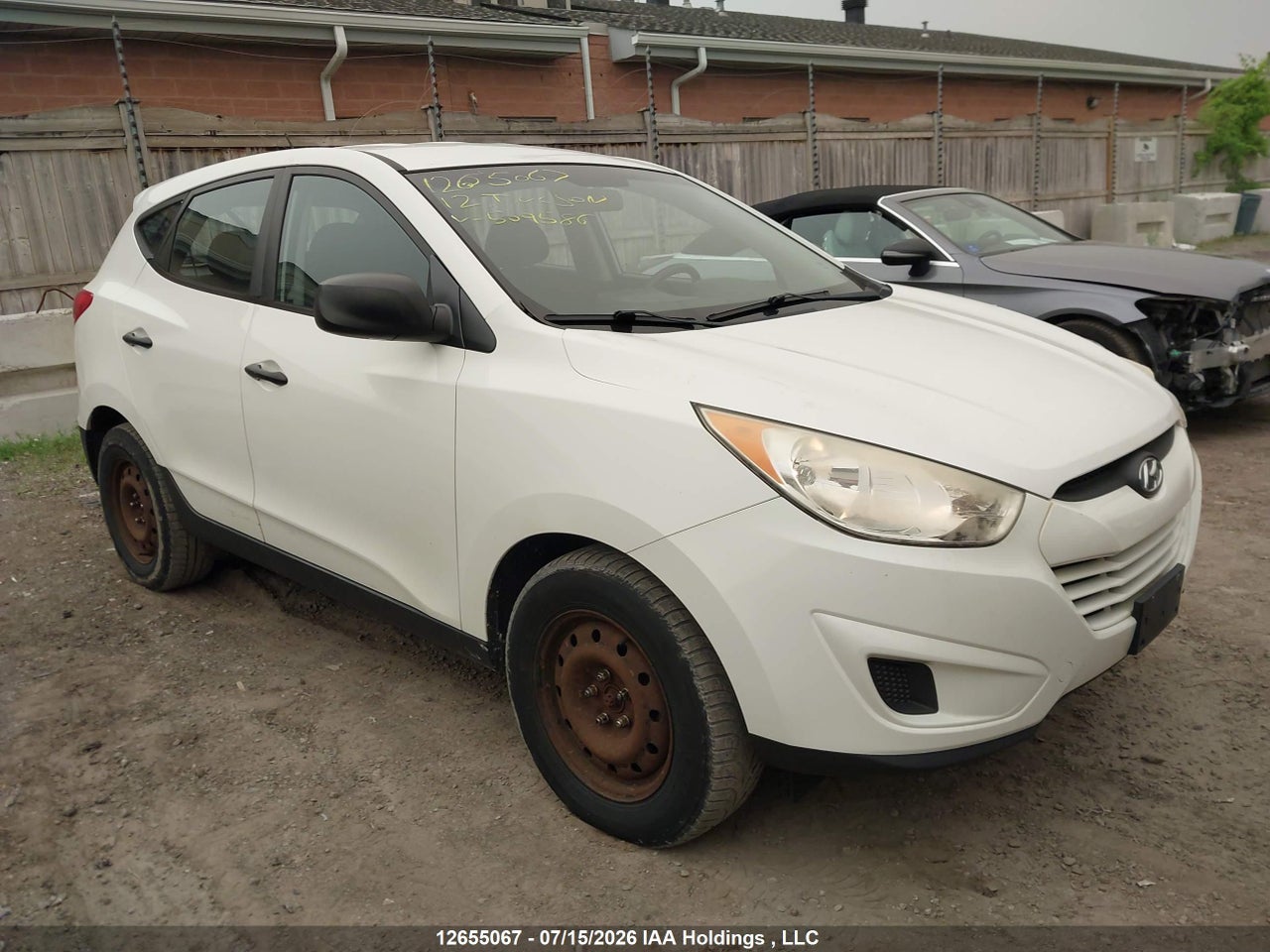 KM8JT3AC4CU509586 · 2012 HYUNDAI TUCSON GL