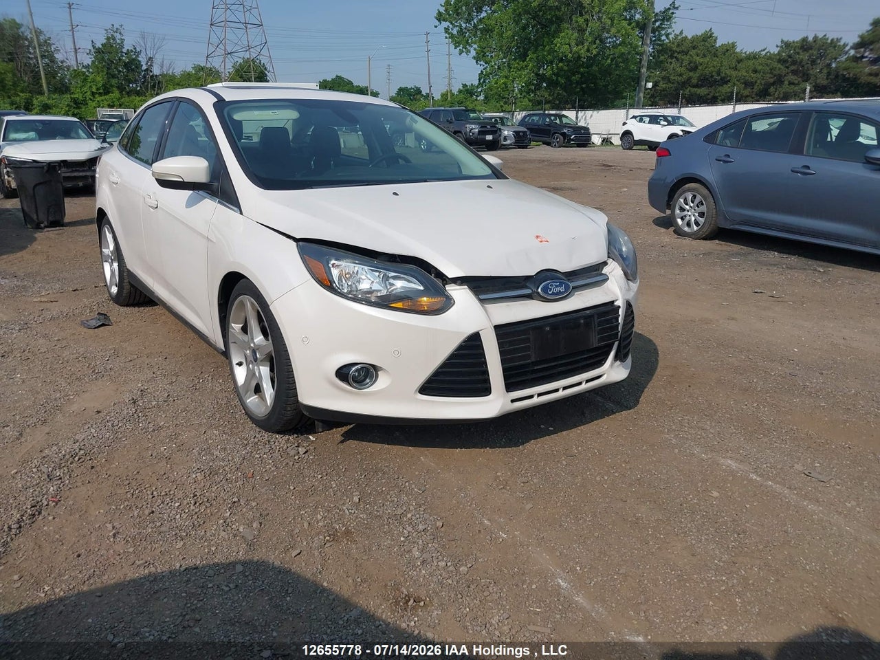 1FAHP3J28CL305285 · 2012 FORD FOCUS TITANIUM