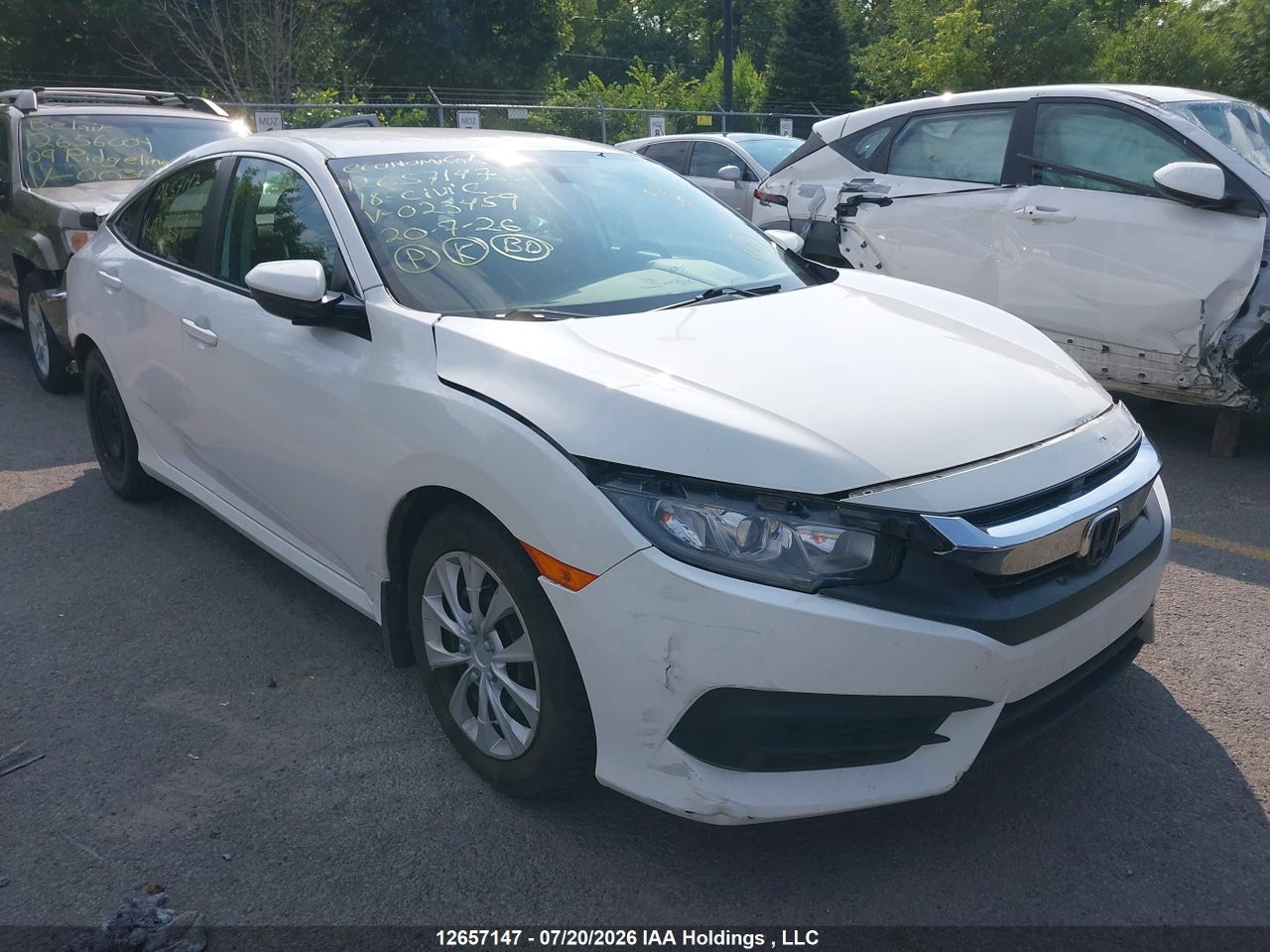 2HGFC2E58JH023459 · 2018 HONDA CIVIC LX