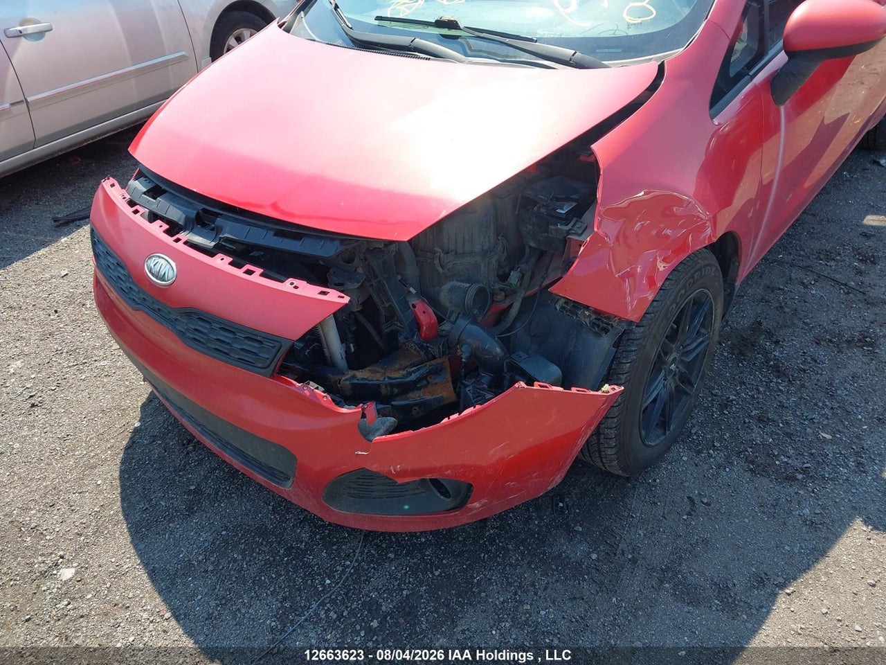 KNADM5A31C6759704 · 2012 KIA RIO LX · 6/21