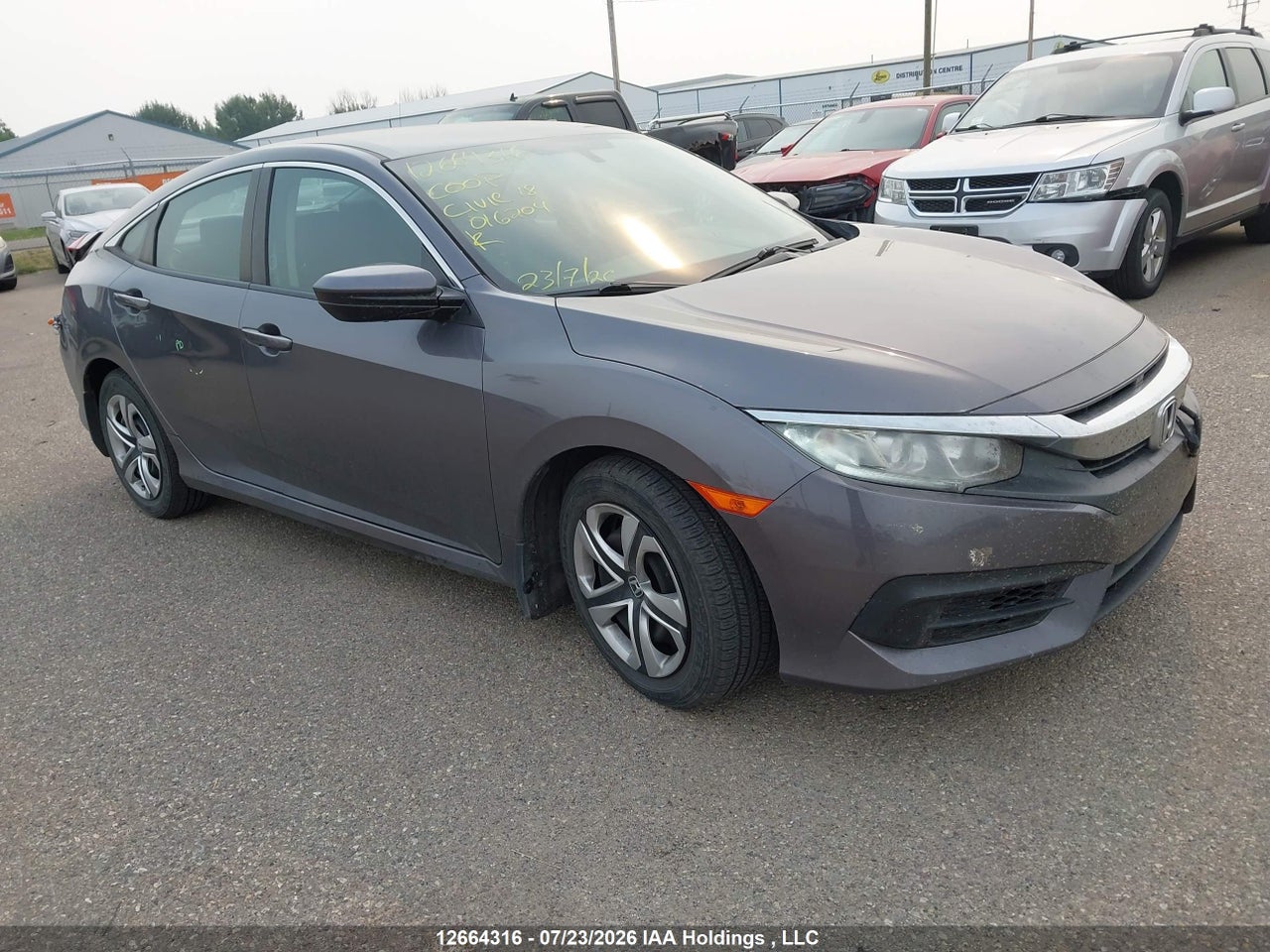 2HGFC2F58JH016204 · 2018 HONDA CIVIC LX