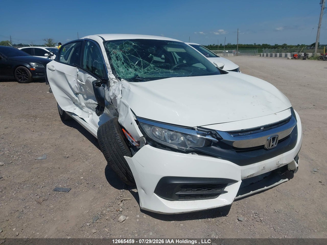 2HGFC2F57JH006750 · 2018 HONDA CIVIC LX