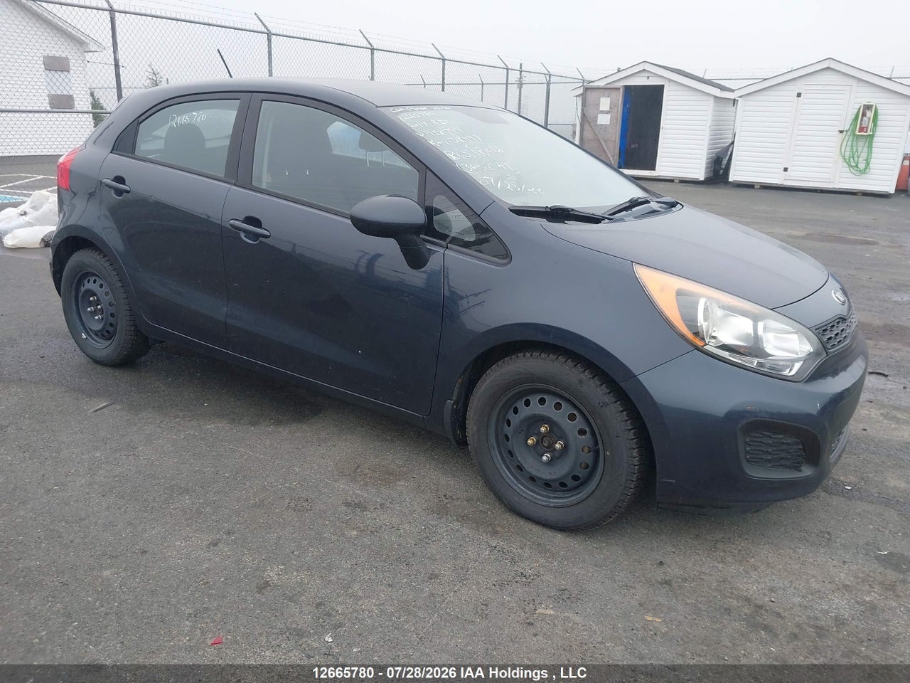 KNADM5A30E6958794 · 2014 KIA RIO LX