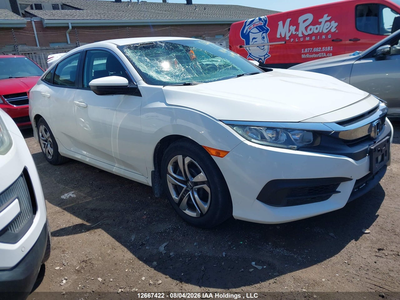 2HGFC2F52JH009992 · 2018 HONDA CIVIC LX